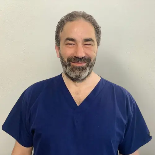 Dr Aiman Sinjab, implant and cosmetic dentist at Allen House Dental in Crewe